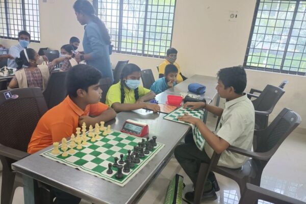 Children playing chess competition