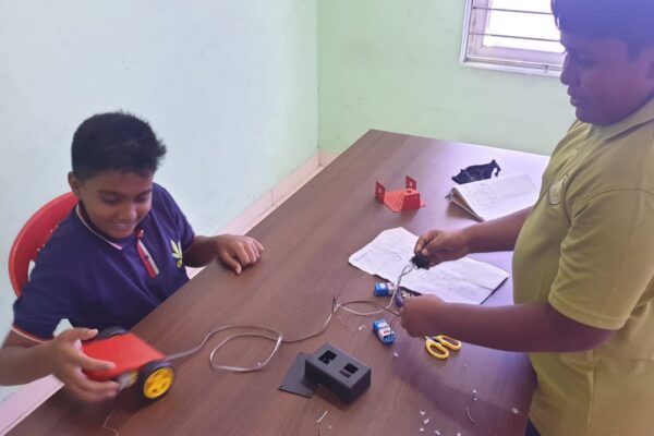 Children with electronics and machinery