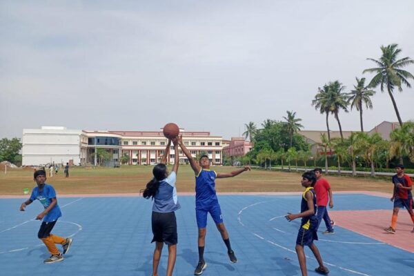 Children playing high intent Basketball